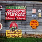drug store drink coca cola signage on gray wooden wall 210126