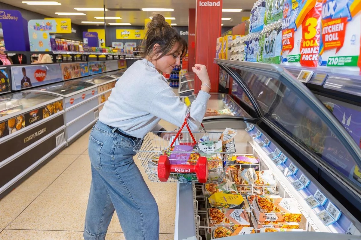 0 a customer lifts the worlds first dumbbell shopping basket available at iceland