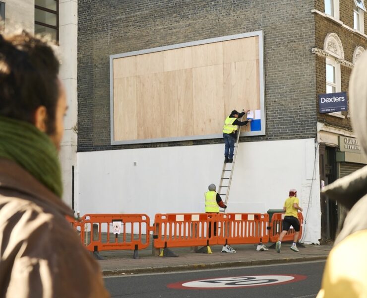 hp prints a billboard live on the street – one a4 sheet at a time