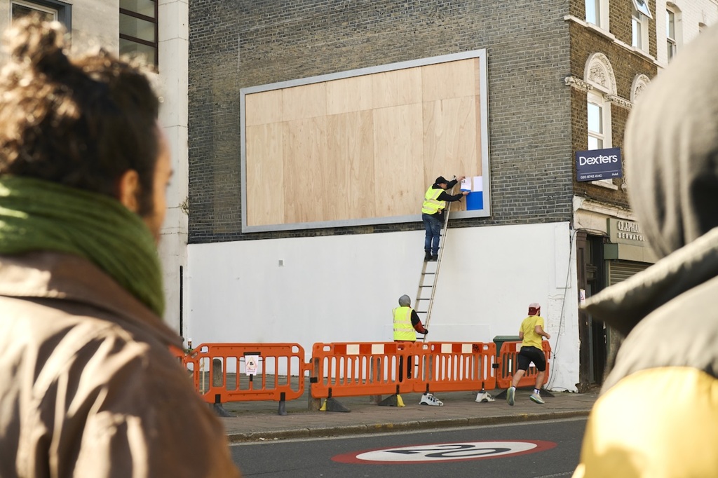 hp prints a billboard live on the street – one a4 sheet at a time